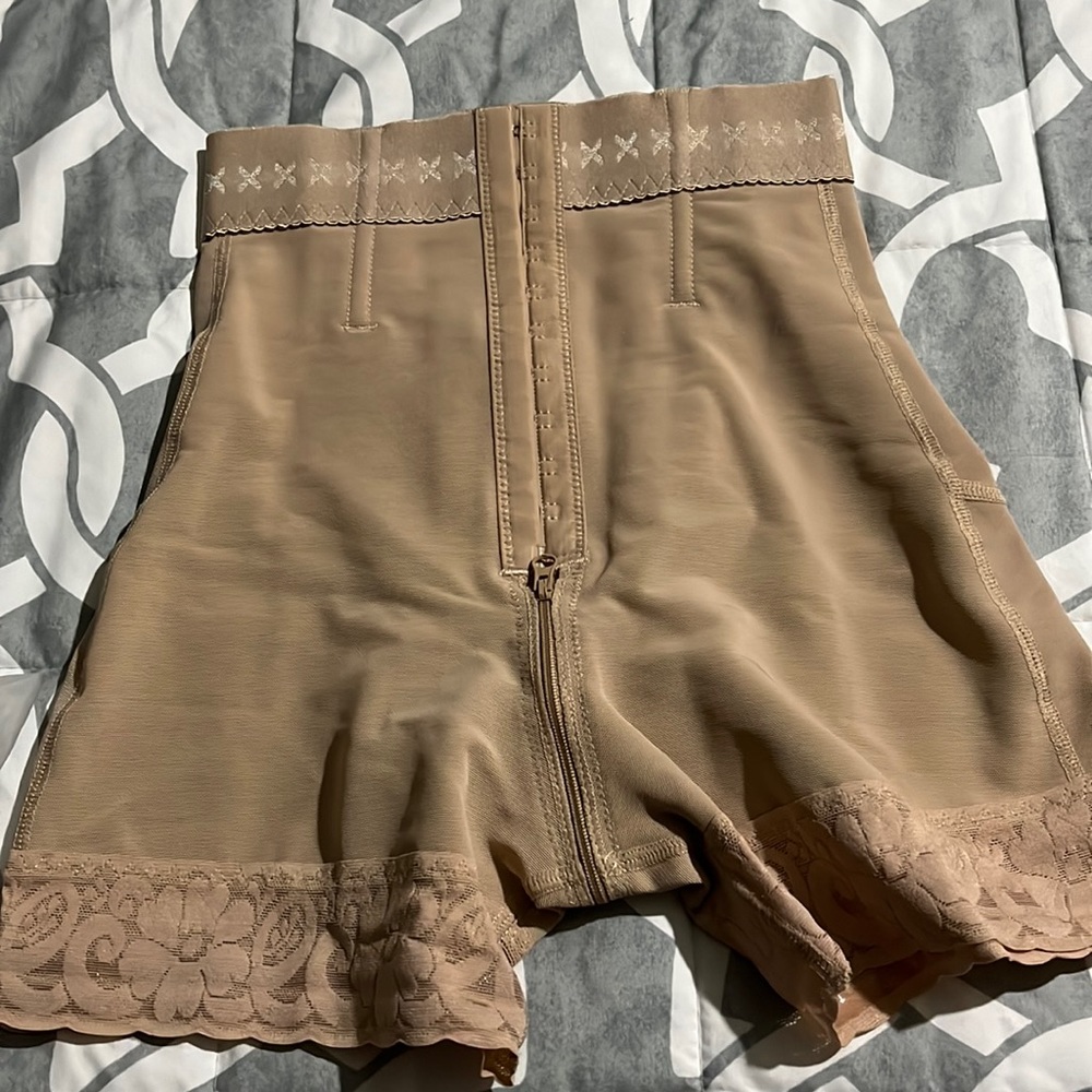 Brand new body shaper short color tan size XS price 75.00